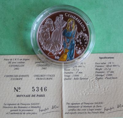 a silver coin with a picture of a woman on it