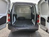 a white van with its doors open on the side of the road