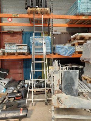 a ladder that is leaning against a wall in a warehouse
