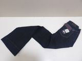 jeans on a white table with a tag on the back of the pants
