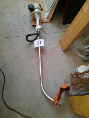 a pair of scissors sitting on the floor next to a wire