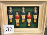 a picture of a group of figurines of soccer players