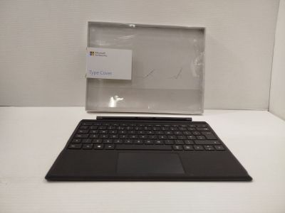 a laptop computer sitting on top of a white table