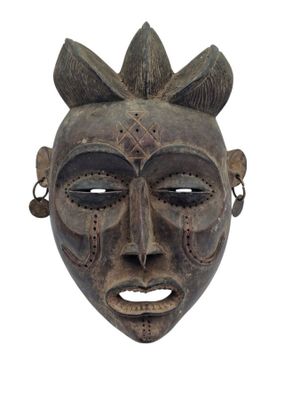 an african mask on a white background with a white background