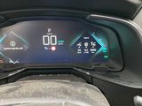 the dashboard of a car with a digital display on the dash