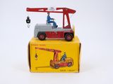 a small toy truck with a crane on top of it