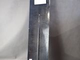 a metal object with a stick sticking out of it
