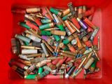 a red container filled with lots of different types of batteries