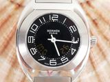 a close up of a watch on a metal bracelet