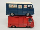 a red truck and a blue truck on top of each other