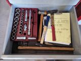 a tool box with tools in it on a table