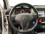 the interior of a car with a steering wheel and dashboard controls