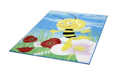 Le tapis est orné d'une abeille et d'une fleur en arrière-plan.