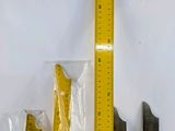 a ruler, a ruler, and a plastic bag on a table