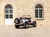 a jeep parked in front of a building with two windows