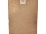 a close up of a piece of paper with a note attached to it