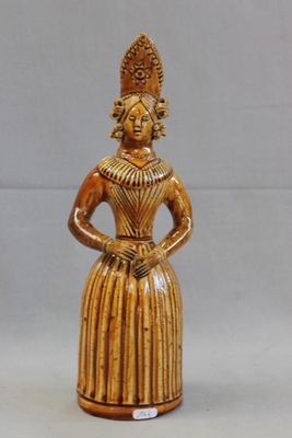 statue of a woman in a dress with a crown on her head