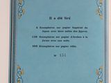 a blue book with a picture of flowers on it