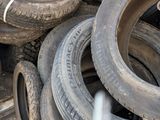several tires are stacked on top of each other in a truck
