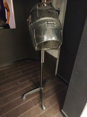 an image of a hair dryer on a stand in a bathroom