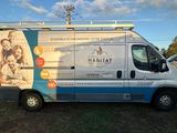 a van that is parked on the side of the road