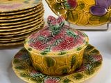many plates and bowls that are sitting on a table