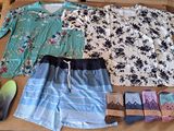 a box with a variety of clothing and shoes on it