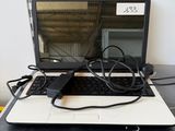 a laptop computer sitting on top of a desk