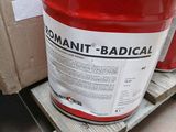 a bucket of cement sitting on a pallet next to a box