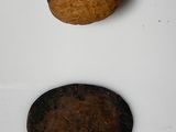 a walnut and a walnut shell on a white surface