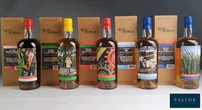 several bottles of alcohol are lined up on a table