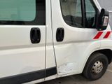 a white van with a red stripe on the side of it