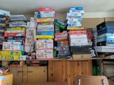 a large pile of boxes sitting on top of a desk