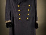 a black coat with gold buttons on the collar and cuffs