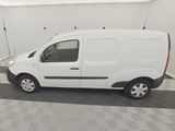the white van is parked in the garage of the building