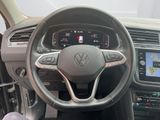 the interior of a car with a steering wheel and dashboard controls