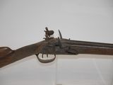a close up of a gun on display in a glass case
