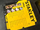 a black and yellow box with a yellow sticker on it