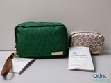 a small green bag and a small brown bag on a table