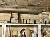 a shelf full of vases and other items in a room