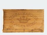 a wooden box with a label on it that says clos du marquets
