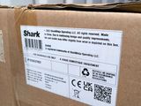 a box with a sticker on it sitting on a table