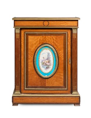 an antique clock with a picture of a woman on it