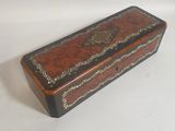 an old wooden box sitting on top of a white surface