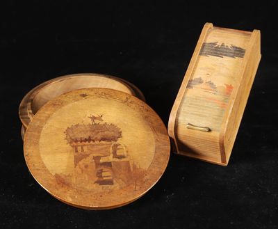 a plate with a picture on it next to a box
