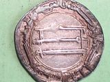an old silver coin with a picture of a man on it