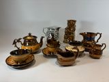 many pieces of pottery sitting on the table together