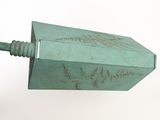 a large green metal object with writing on it