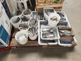 a lot of silverware on a pallet in a store