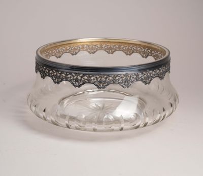 a close up of a glass bowl on a white surface